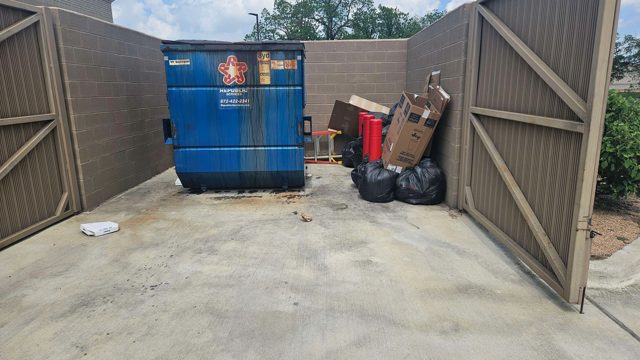 Cleared dumpster enclosure