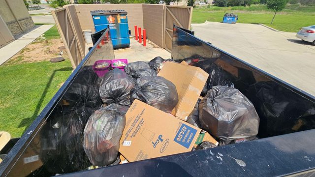 Bagged junk and cardboard in the trailer
