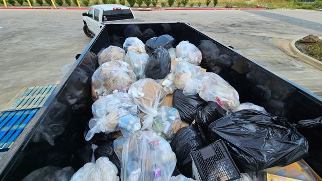 Full trailer of bagged waste